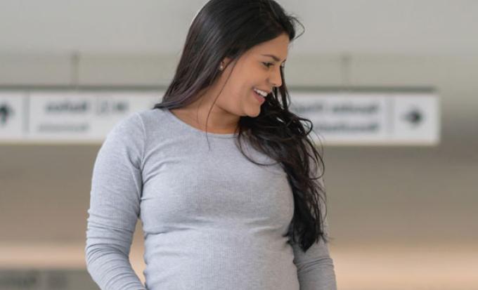 pregnant woman walking at event