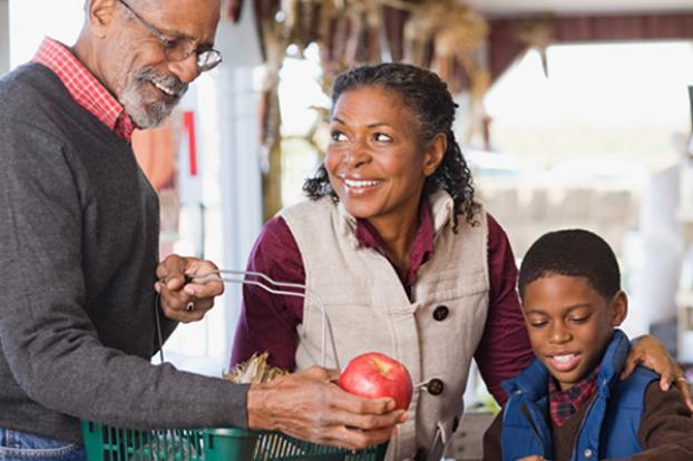 Shopping for apples with family.