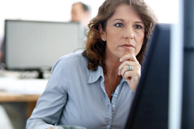 Researcher looking at computer monitor.