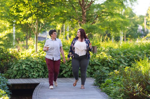 Couple walk on path in park