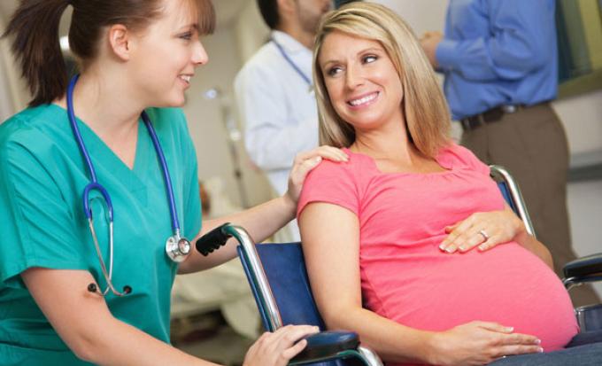 Nurse and pregnant mom in wheelchair