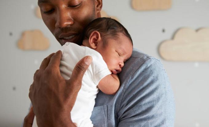 Father holding newborn