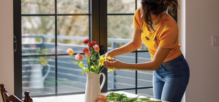 Arrange bouquet at table.