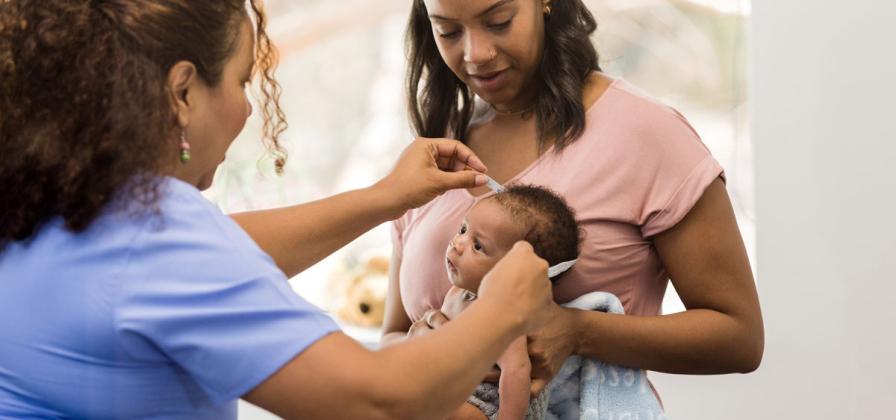 Infant having doctor check up. 