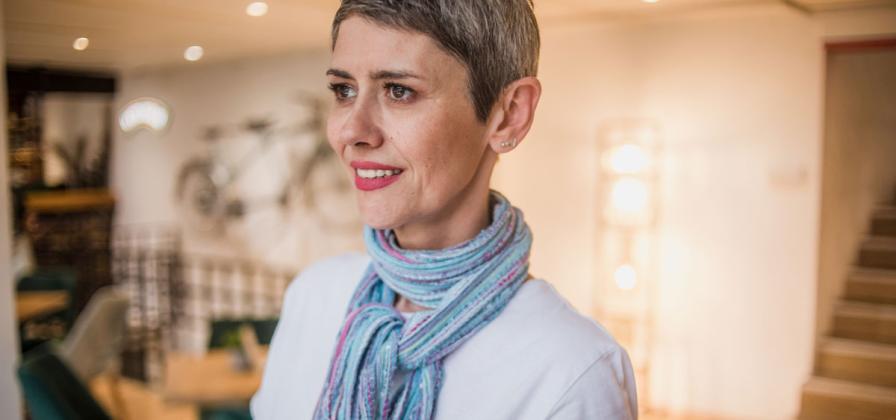 Multicolored scarf and short hair.