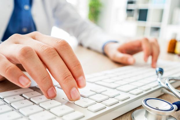 Typing on computer keyboard close-up